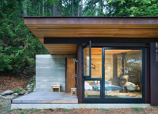 Contemporary cabin with outdoor shower and floor-to-ceiling glass