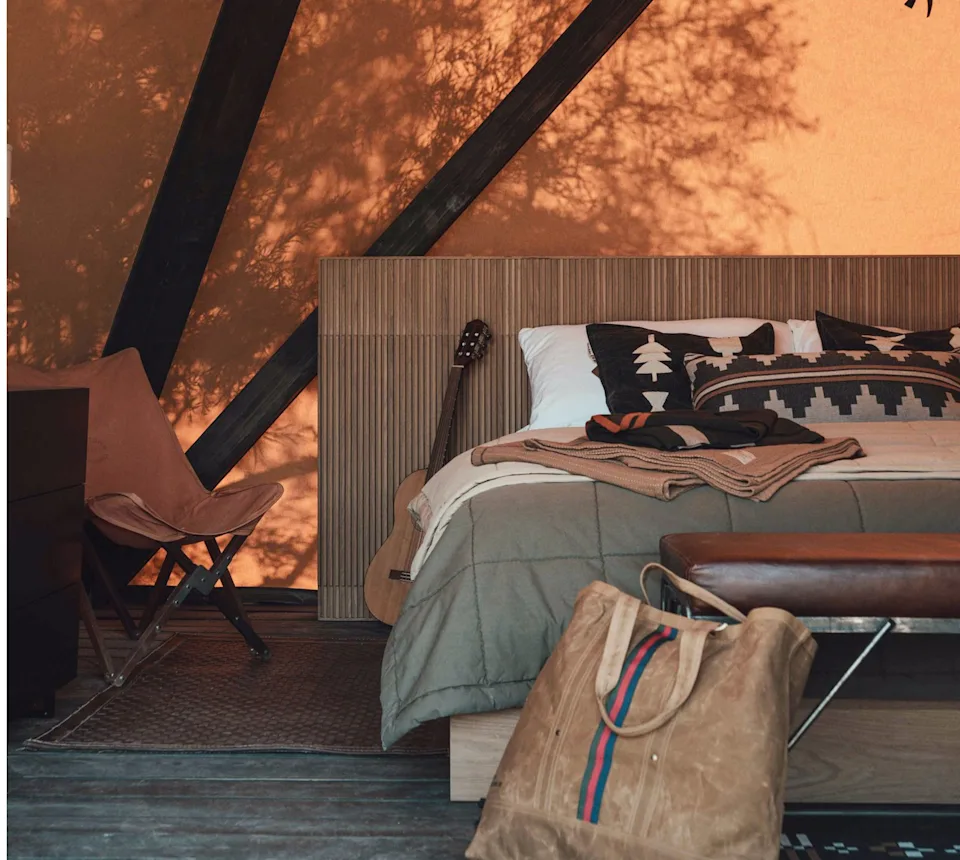 Spacious yurt interior with plush furnishings