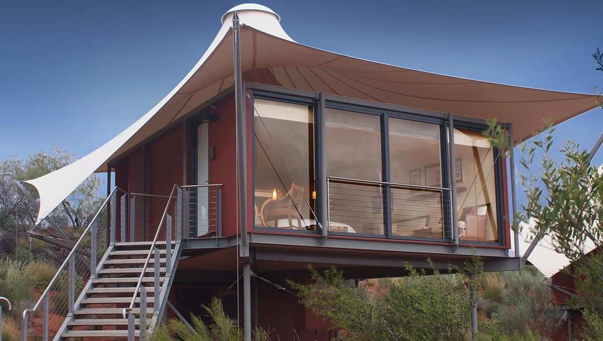 Yurt nestled in a forested mountain setting