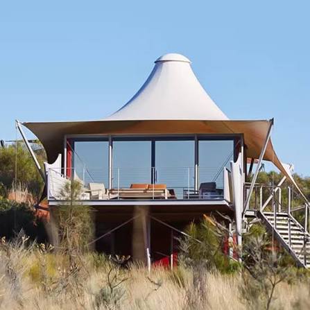 Cozy yurt bedroom with king-size bed and ambient lighting